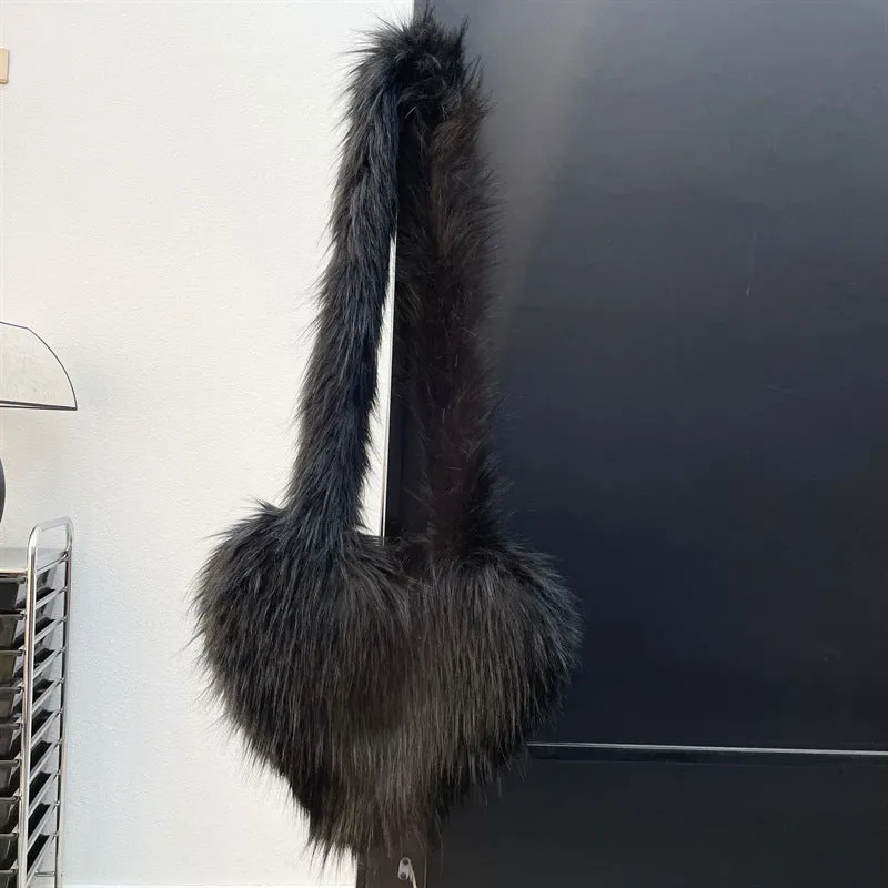 Women winter fleece heart shape crossbody bag with plush exterior, tassel detail, and large capacity
