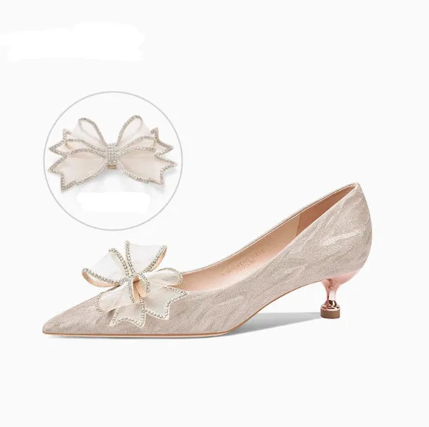 Women's champagne gold sequined pointed stiletto heel pumps for weddings, shown on a plain background.