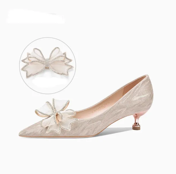 Women's champagne gold sequined pointed stiletto heel pumps for weddings, shown on a plain background.