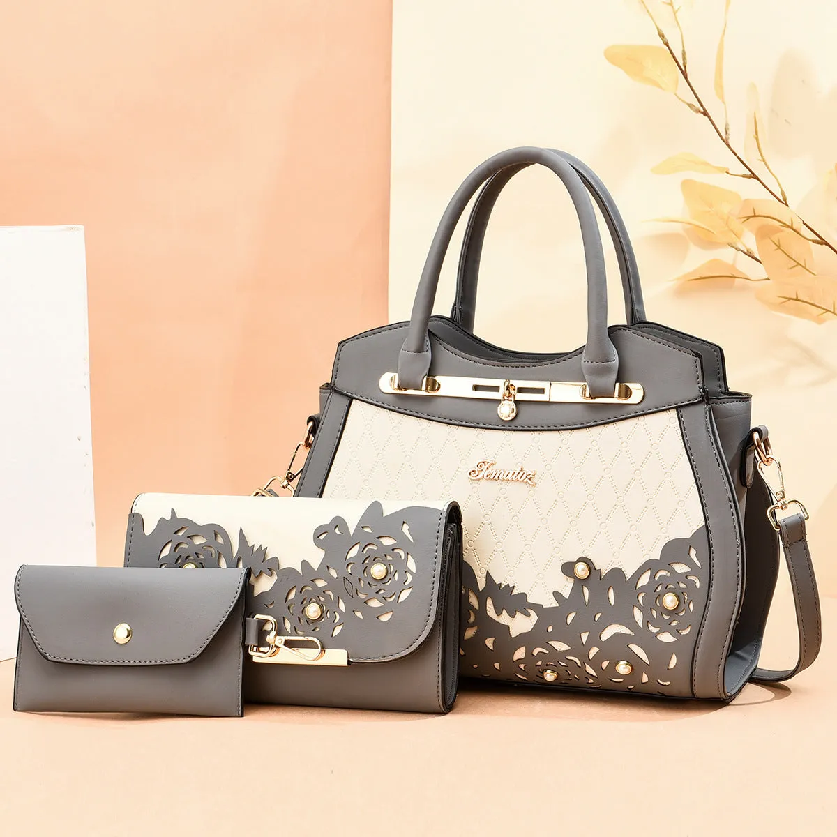Three-piece PU leather handbag set in black includes large handbag, wallet, and small square bag with zipper closure
