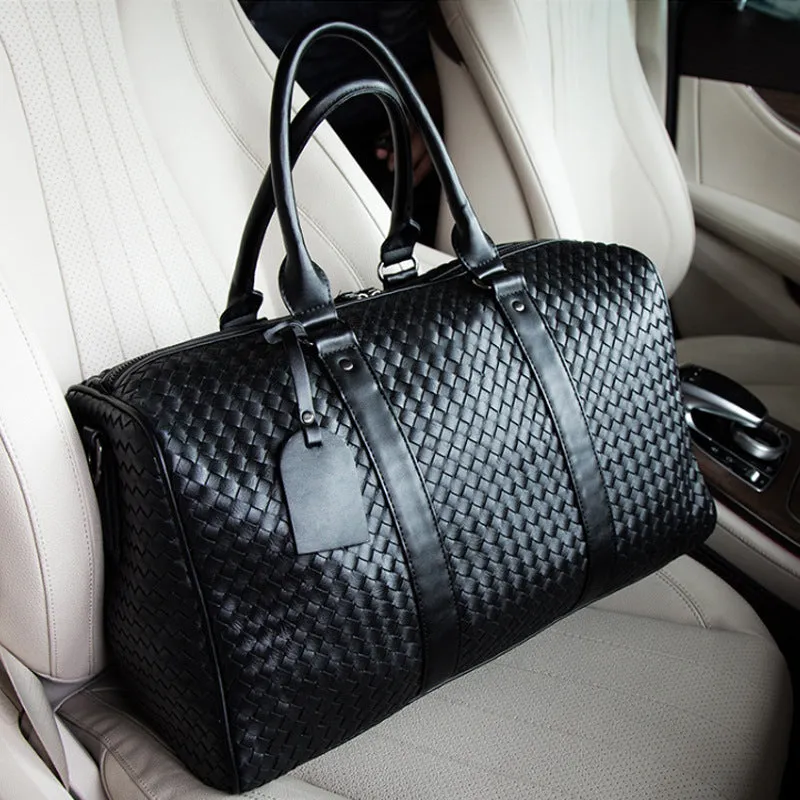 Black medium PU leather shoulder bag with woven texture and zipper closure for travel and business use
