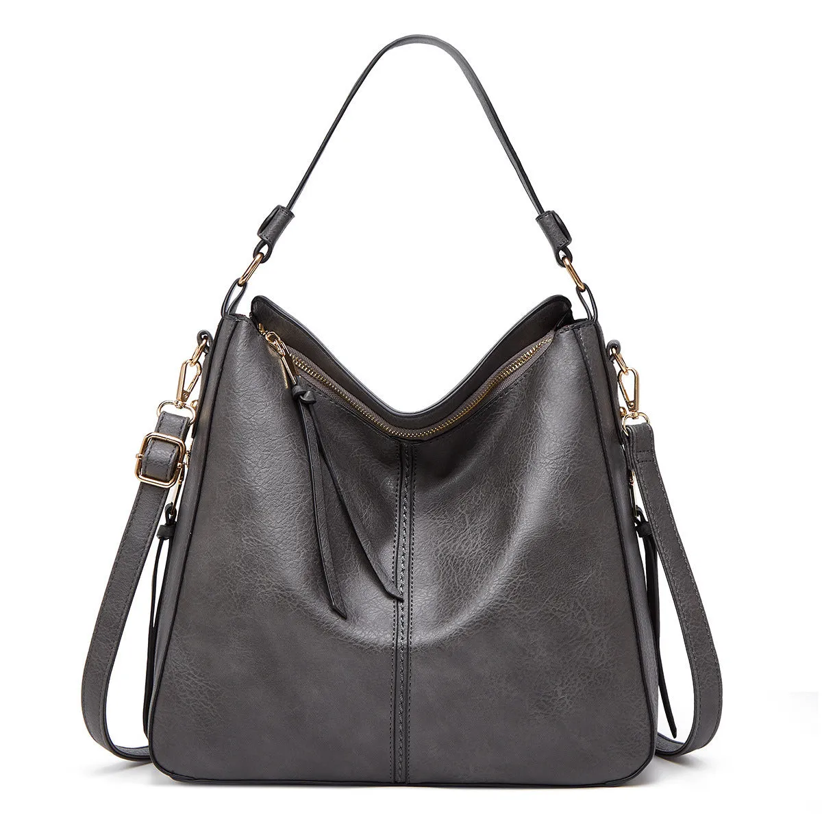 Hobos zipper bucket bag in black with adjustable shoulder strap on a woman's shoulder