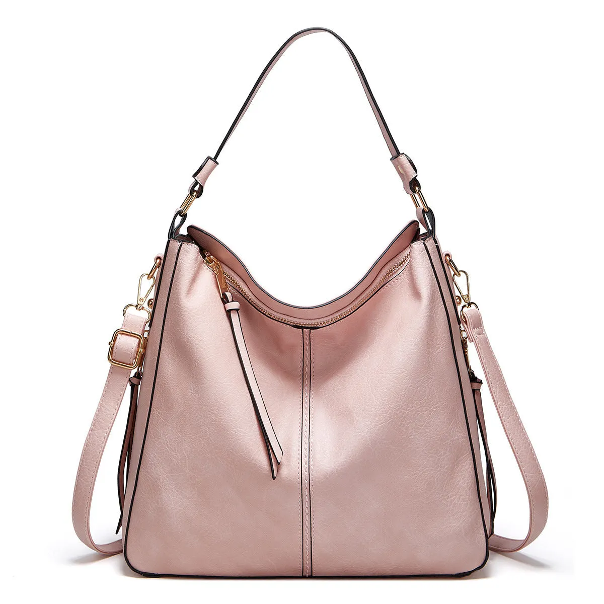 Hobos zipper bucket bag in black with adjustable shoulder strap on a woman's shoulder