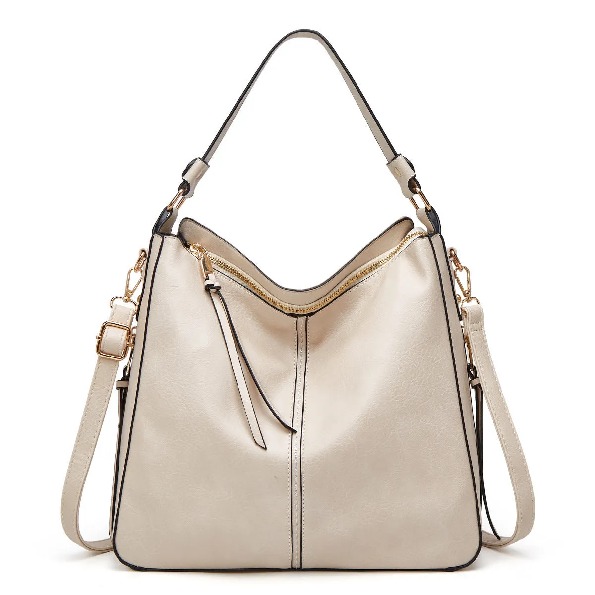 Hobos zipper bucket bag in black with adjustable shoulder strap on a woman's shoulder