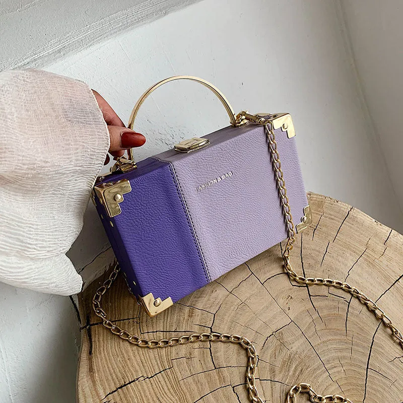Ladies party clutch bag in orange with box handle and long chain, PU artificial leather, 19x5x12cm