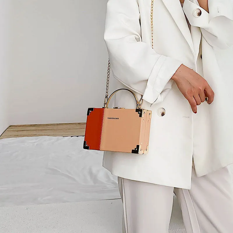 Ladies party clutch bag in orange with box handle and long chain, PU artificial leather, 19x5x12cm