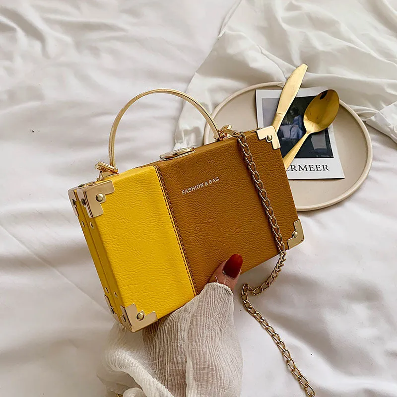 Ladies party clutch bag in orange with box handle and long chain, PU artificial leather, 19x5x12cm