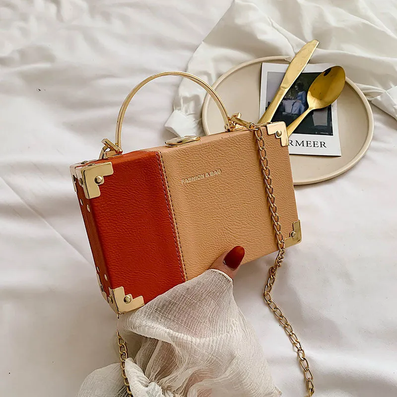 Ladies party clutch bag in orange with box handle and long chain, PU artificial leather, 19x5x12cm