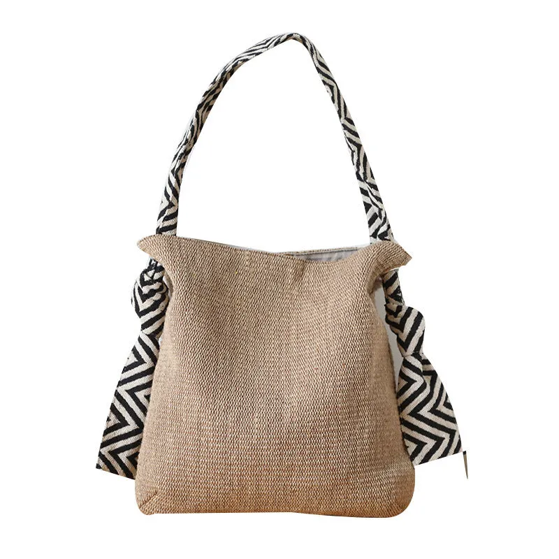 Khaki one-shoulder polyester canvas tote bag with cotton lining, magnetic closure, and internal pockets on a plain background