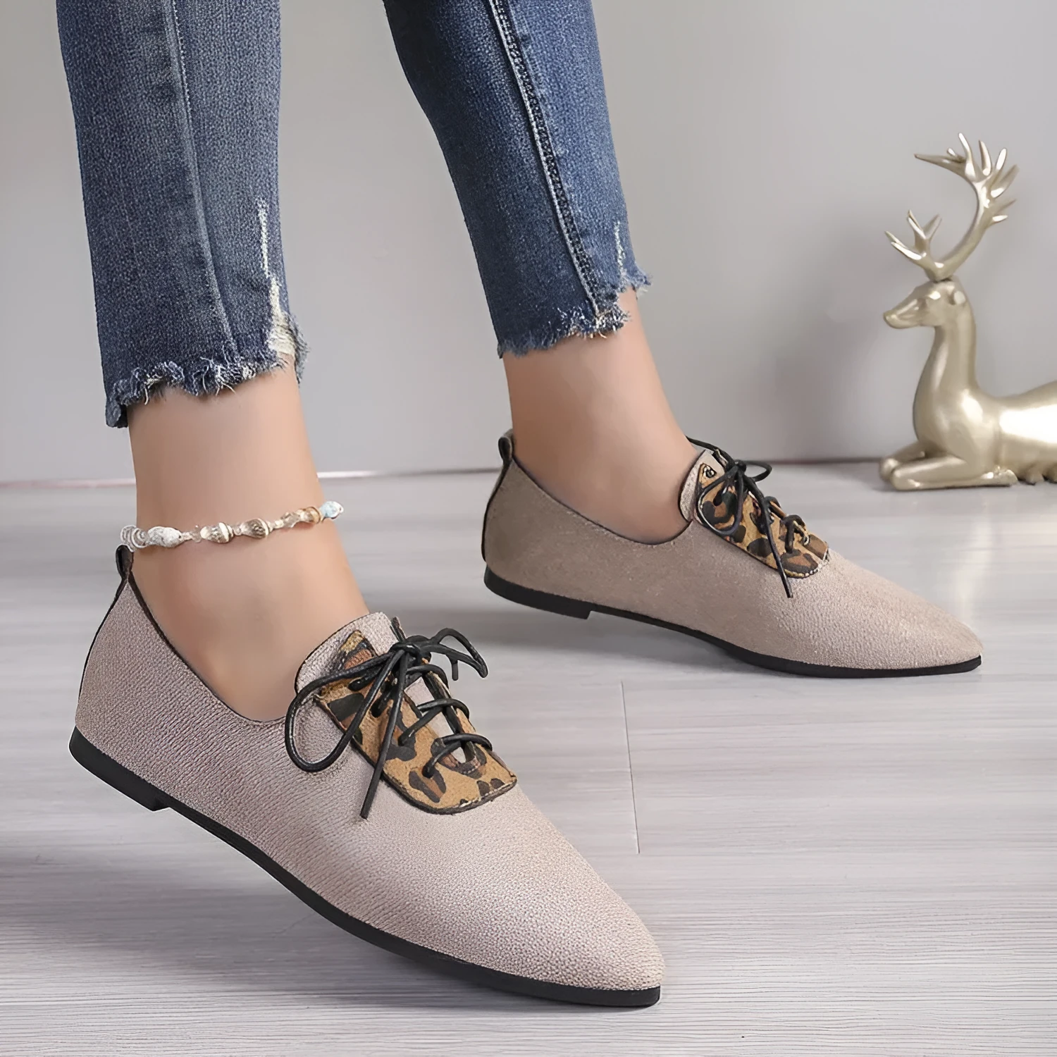 Beige leopard print pointed toe stiletto pumps for women, showing the shoe's side profile.