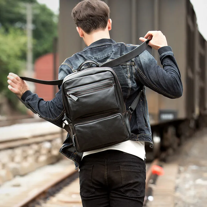 Black cowhide leather backpack 39x30x14cm with zipper closure and sewing thread detailing