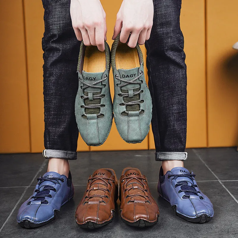 Men's solid colour lace-up casual sneakers with car stitching, blue upper, side view