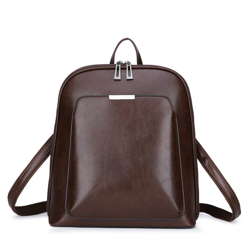 Women's fashion PU backpack in black with shoulder strap and top handle, casual daypack design.