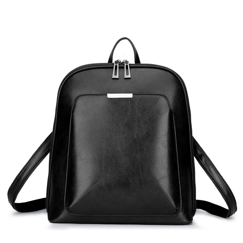 Women's fashion PU backpack in black with shoulder strap and top handle, casual daypack design.