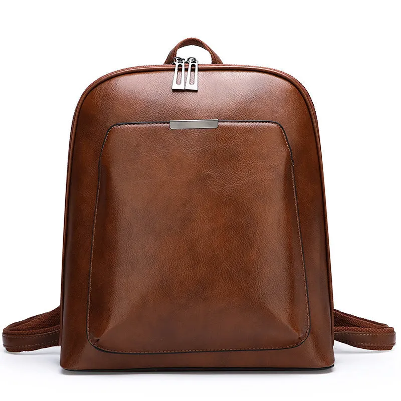 Women's fashion PU backpack in black with shoulder strap and top handle, casual daypack design.