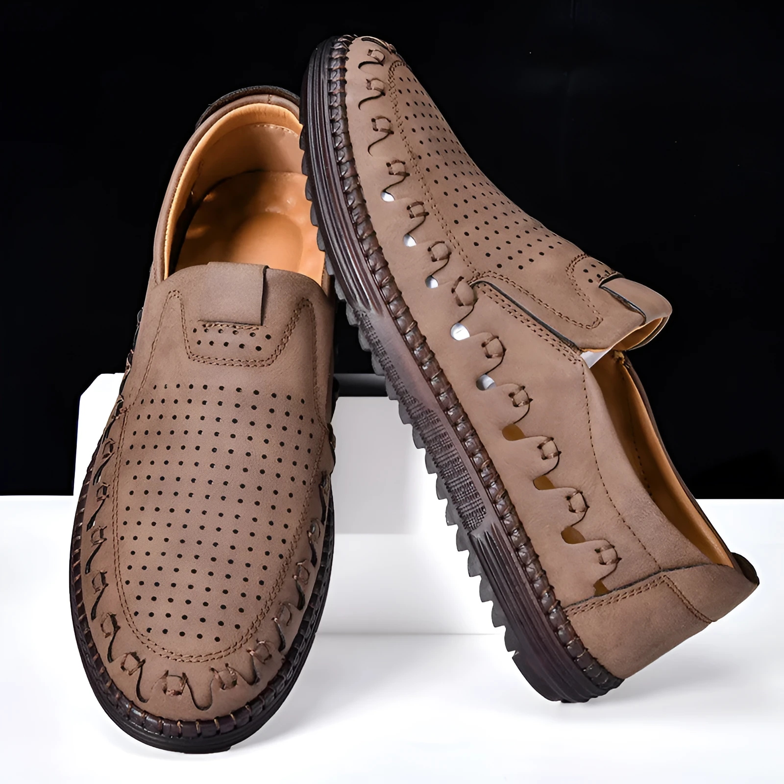 Men's brown handmade leather slip-on casual shoes with flat heel and round toe.