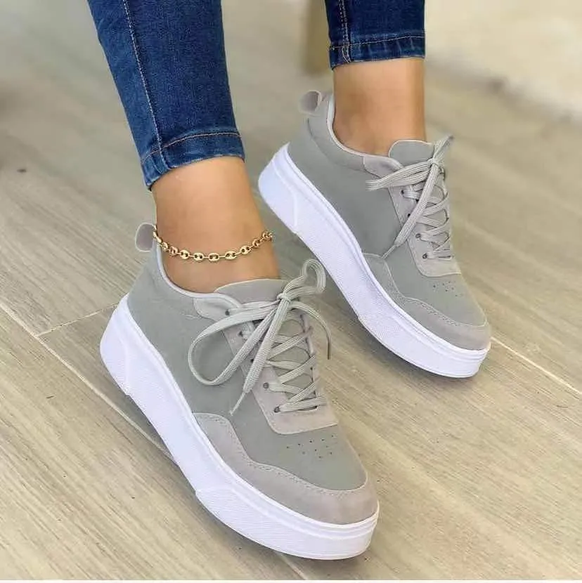 Women's casual lace-up flat sneakers in green with mesh upper and thick rubber sole