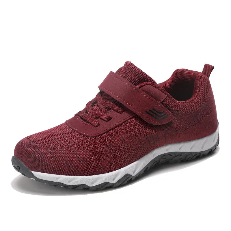 Women's low-top wedge heel shoes in grey purple with velcro strap and mesh upper.
