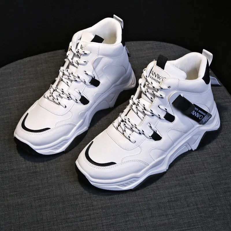 Women's high top white sneakers with PU upper, rubber sole, lace-up fastening on a plain background