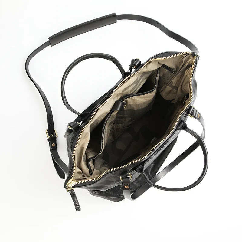 Black handmade vegetable tanned cowhide tote bag with zipper closure and 15-inch computer slot for daily outdoor use