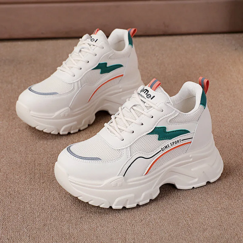 Women's white breathable dad shoes with lace-up front and cross shoulder strap on a rubber sole.