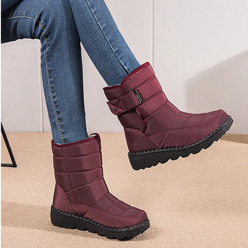 Women's waterproof snow boots with canvas upper, PU sole, buckle closure, and belt decoration