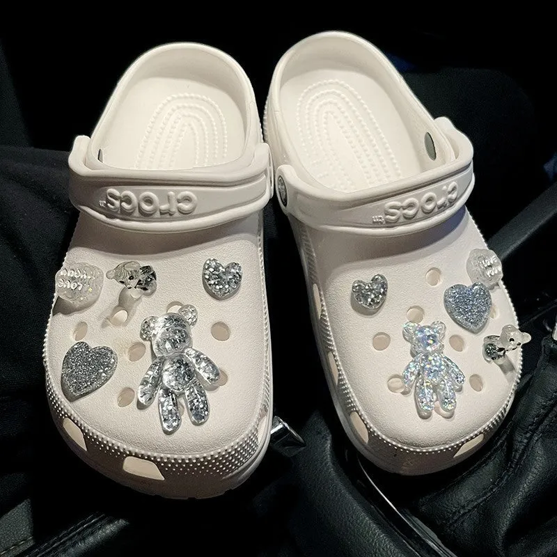 Crystal cloud bear shoe buckle set with resin, plush, and plastic details on a white background