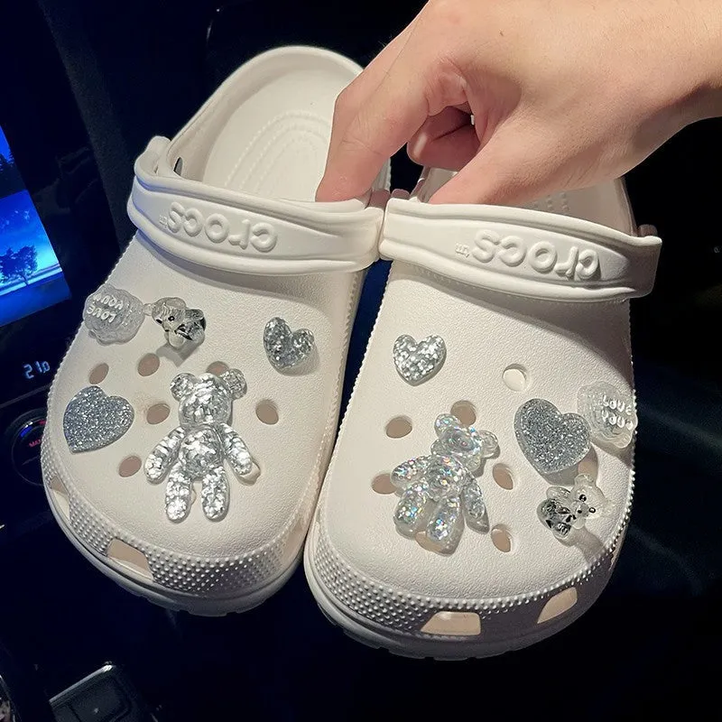 Crystal cloud bear shoe buckle set with resin, plush, and plastic details on a white background