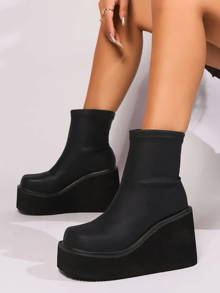 Plus size women's black wedge heel ankle boots with waterproof platform sole and round toe