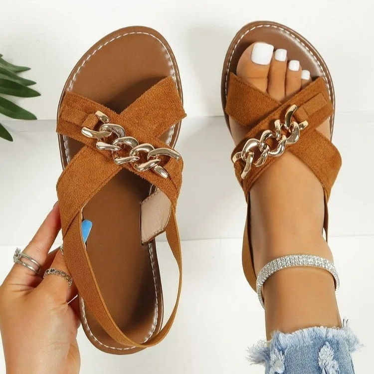Chains sandals in black with elasticated open toe slide design, rubber sole, and metal detail on PU upper