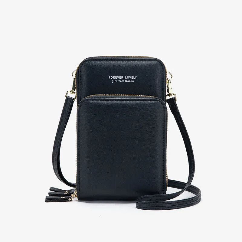 Green crossbody bag with tri-fold pockets and zipper closure on white background