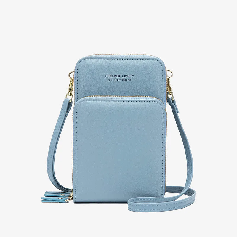 Green crossbody bag with tri-fold pockets and zipper closure on white background