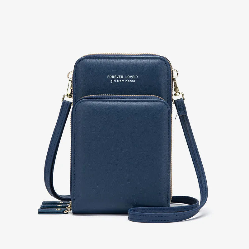 Green crossbody bag with tri-fold pockets and zipper closure on white background