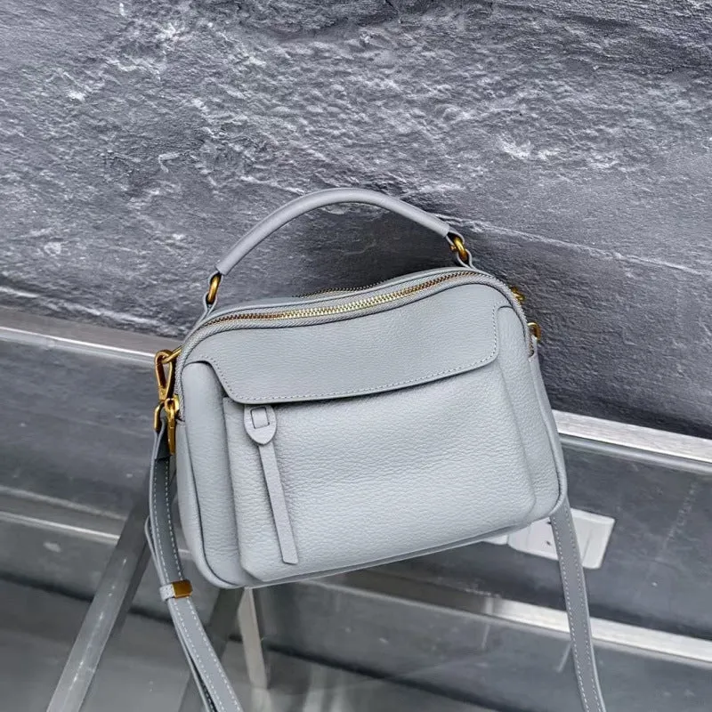 Genuine leather multi-compartment shoulder handbag in almond white with sewing thread detail and outer sandwich pocket