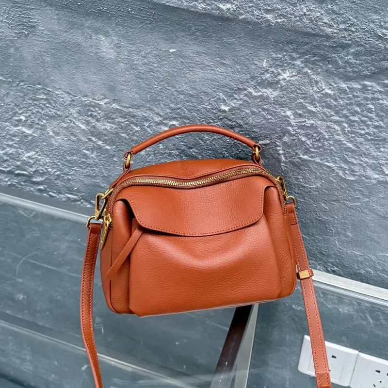 Genuine leather multi-compartment shoulder handbag in almond white with sewing thread detail and outer sandwich pocket