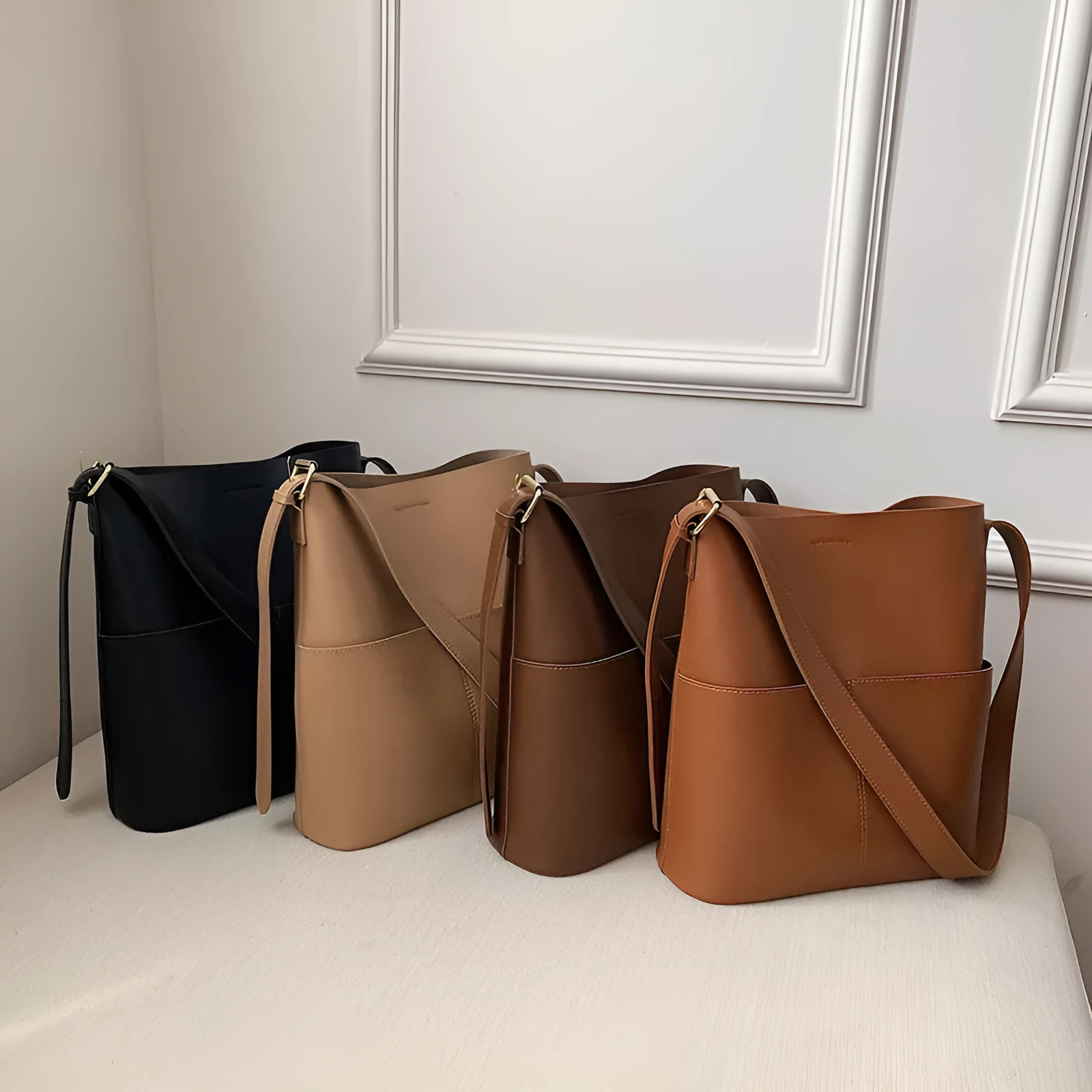 Large capacity PU shoulder bag in black with decorative seaming and sandwich pocket