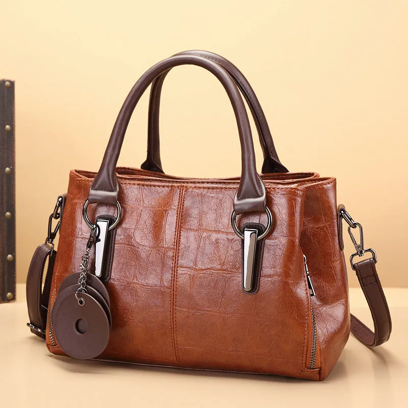 Large capacity shoulder bag with urban simplicity style, showing internal zipper compartments and contrasting sewing thread details