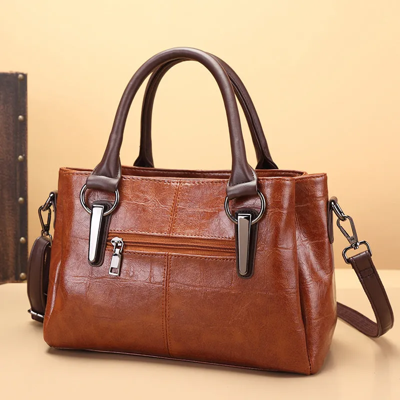Large capacity shoulder bag with urban simplicity style, showing internal zipper compartments and contrasting sewing thread details