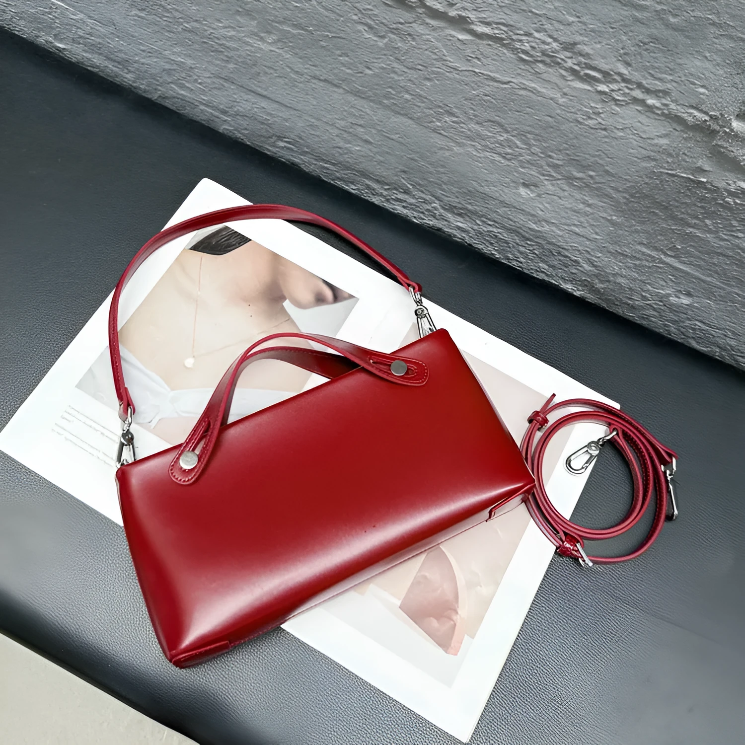 Genuine leather messenger shoulder bag in Wine Red, horizontal square shape, visible sewing thread detailing