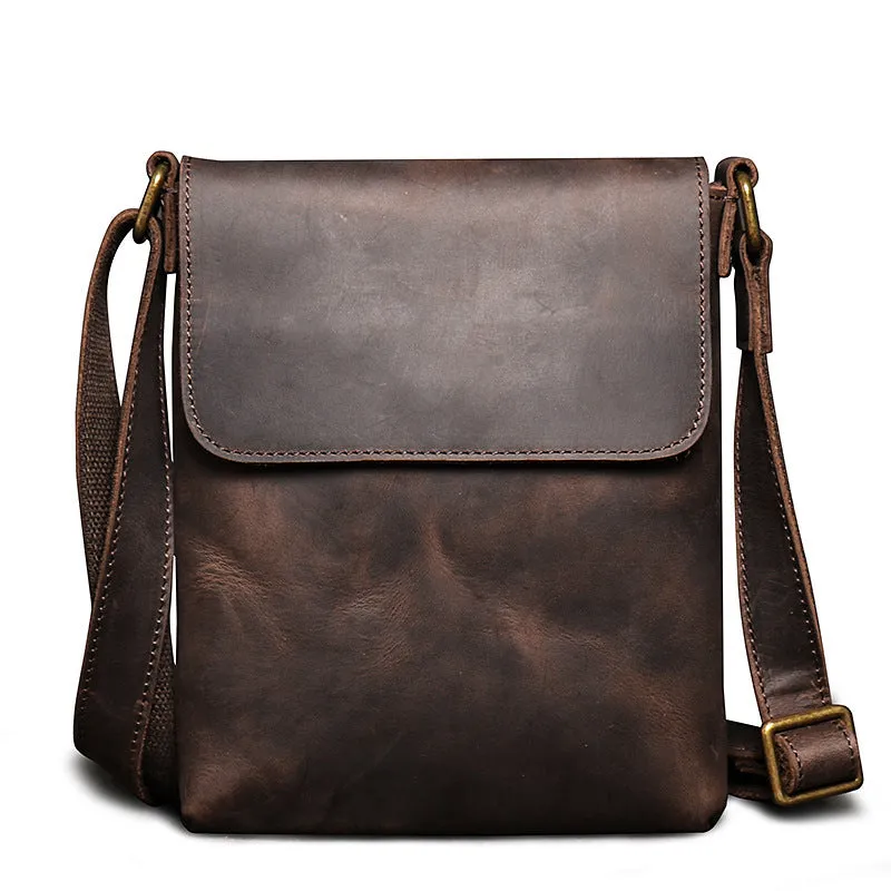 Men's genuine leather messenger bag in retro solid colour black shown on a table
