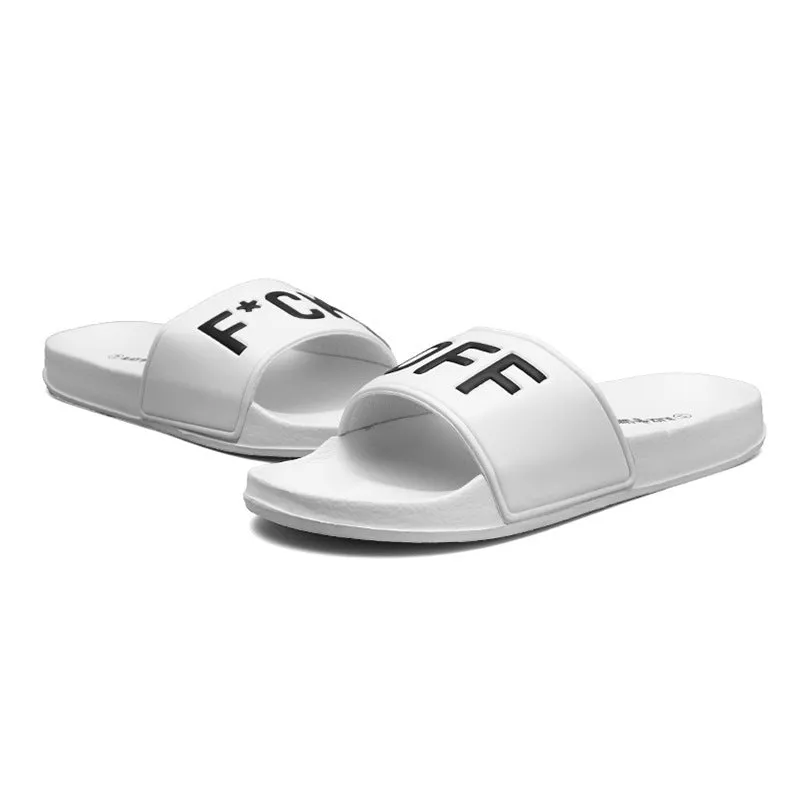 Men's large black and white open toe slippers with a rubber sole on a plain background.