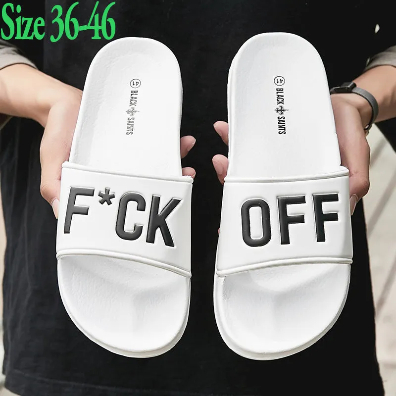 Men's large black and white open toe slippers with a rubber sole on a plain background.