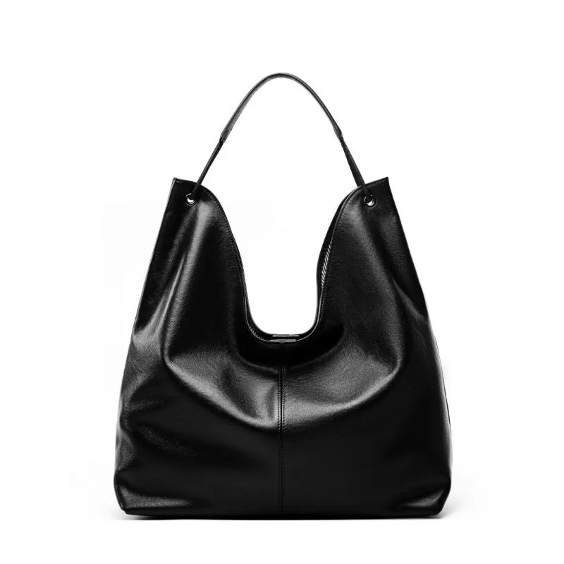 Brown genuine leather tote bag with contrast stitching and large capacity, front view on white background