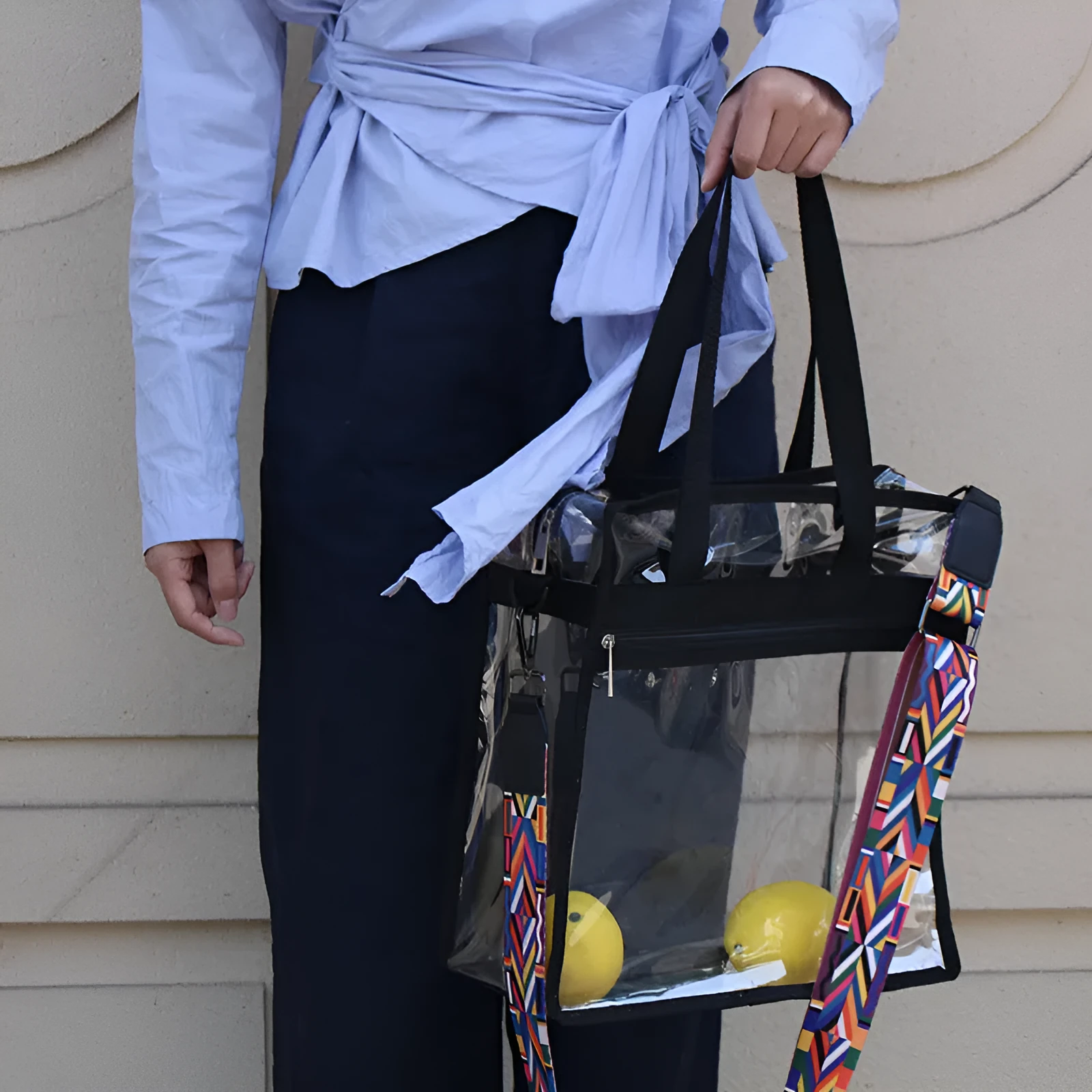 Women's transparent PVC crossbody messenger bag with a black side net pocket, shown in a horizontal square shape.