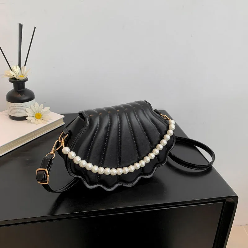 Women's simple messenger bag in PU shell shape with single shoulder strap, available in multiple colours