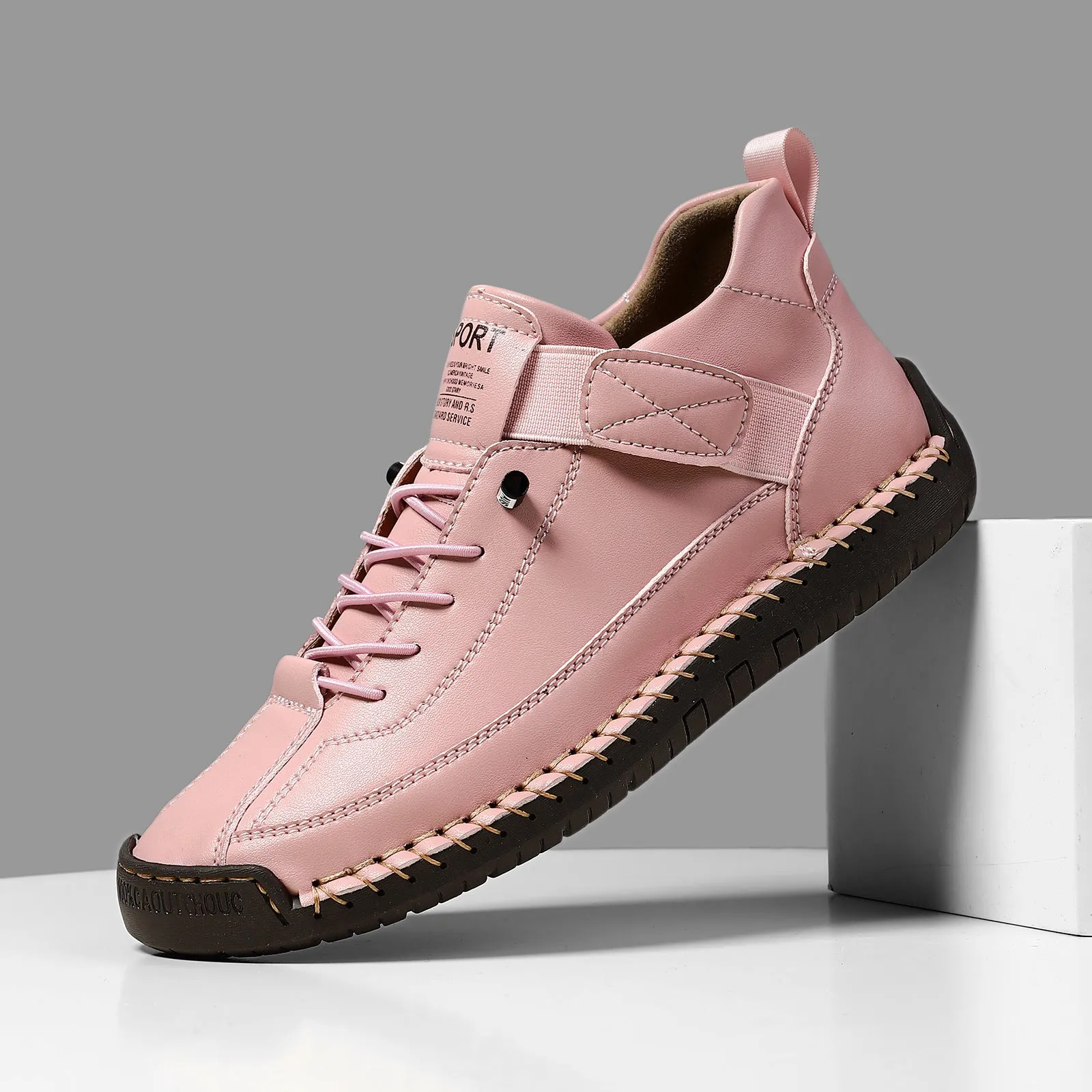 Men's mid-calf Martin boots in khaki with visible tooling stitching and an elastic band across the instep.