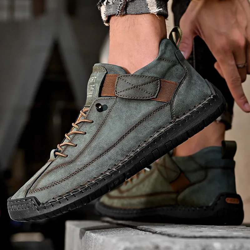 Men's mid-calf Martin boots in khaki with visible tooling stitching and an elastic band across the instep.