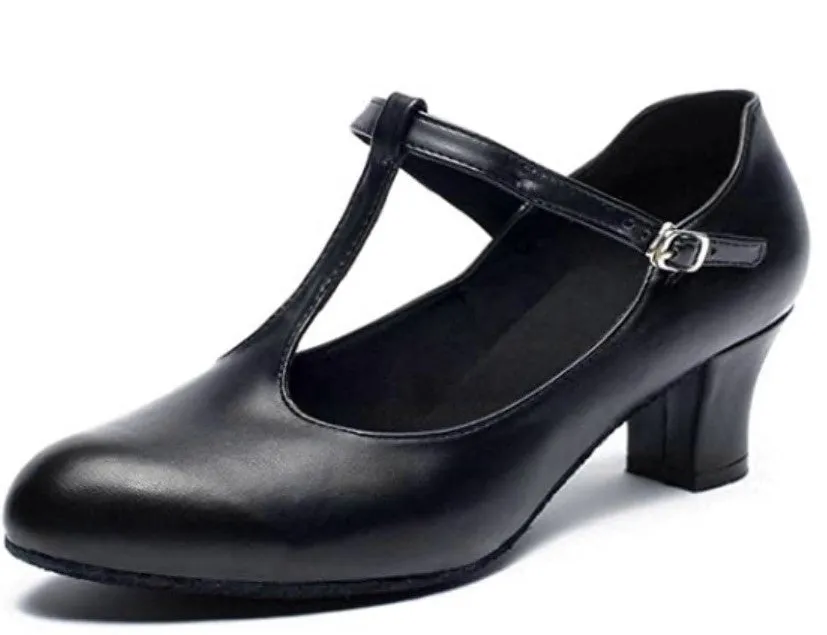 Women's black leather Latin dance shoes with T-shaped straps on a wooden dance floor
