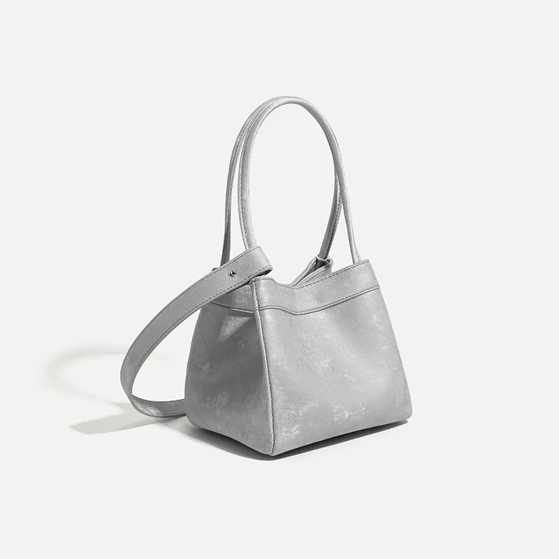 Portable shoulder crossbody bag in black PU leather with open pocket outer and sewing thread detail
