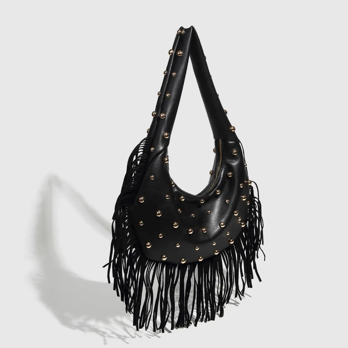Retro black shoulder handbag with a gold tassel detail and structured shape.